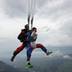 Illustration for article titled Pure Nerd Insanity: Two Men Skydiving with a Girly Hug Pillow